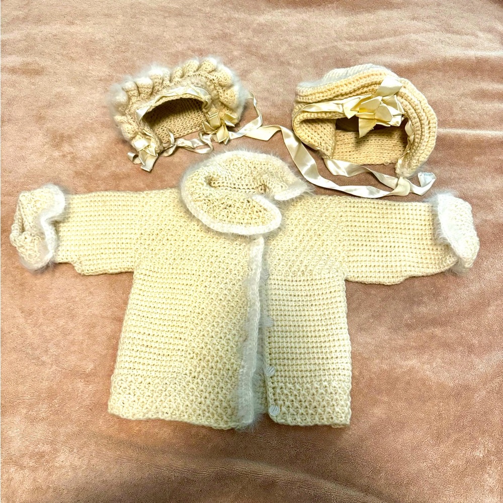 One of a kind, vintage 60’s baby sweater with 2 hats. Size 0-6 months.